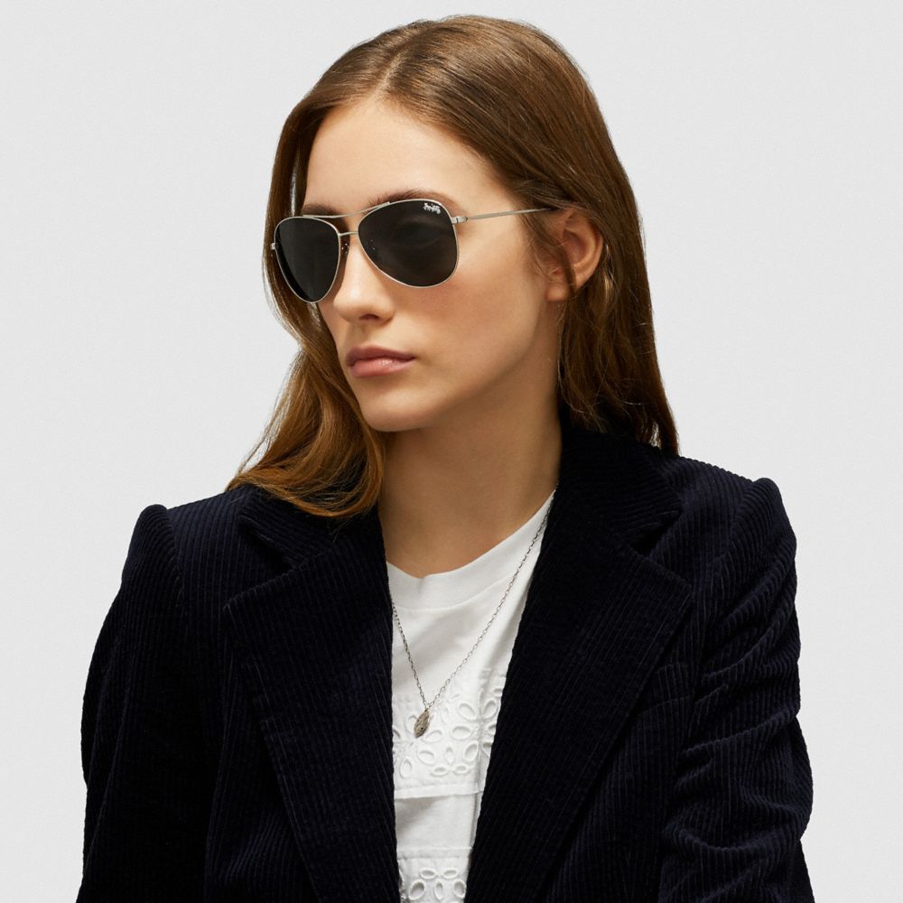 coach sunglasses on model